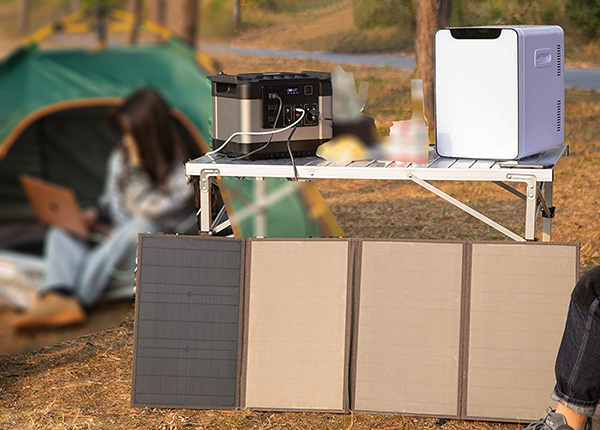 charging by solar panel camping outdoors .jpg